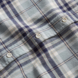 material shot of the natural buttons on The Ledge Shirt in Faded Blue Plaid