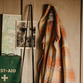 The Ledge Shirt in Sunrise Plaid hanging on a wall