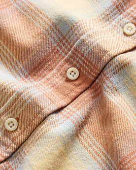 material shot of the natural colored buttons on The Ledge Shirt in Sunrise Plaid, Wovens by Taylor Stitch