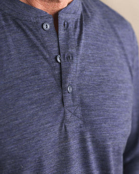 fit model showing off the buttons on The Merino Henley in Heather Navy, Knits by Taylor Stitch