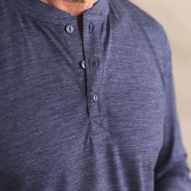 fit model showing off the buttons on The Merino Henley in Heather Navy