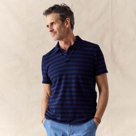 fit model posing in The Organic Cotton Polo in Washed Indigo Stripe