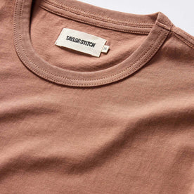 material shot of the ribbed neck opening on The Organic Cotton Tee in Faded Brick
