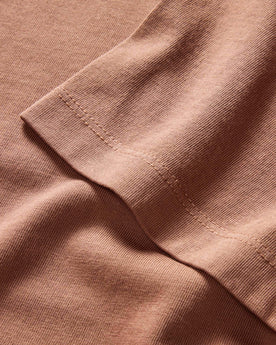 material shot of the sleeve on The Organic Cotton Tee in Faded Brick, Knits by Taylor Stitch