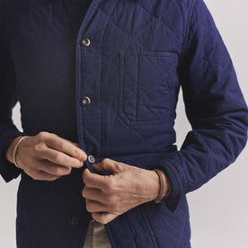 fit model buttoning up The Ojai Jacket in Indigo Diamond Quilt