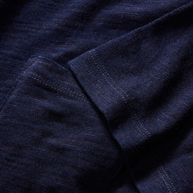 material shot of the sleeves and pocket on The Organic Cotton Tee in Rinsed Indigo