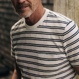 fit model showing off pocket detailing on The Organic Cotton Tee in Washed Indigo Stripe