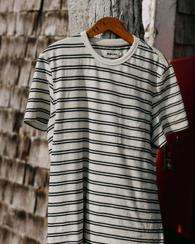 editorial image of The Organic Cotton Tee in Washed Indigo Stripe on a hanger, Knits by Taylor Stitch