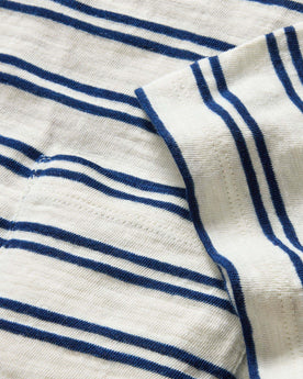 material shot of the sleeve and pocket on The Organic Cotton Tee in Washed Indigo Stripe, Knits by Taylor Stitch