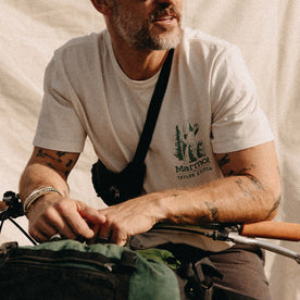 fit model sitting on a bike in The Organic Cotton Tee in Trail Buddies
