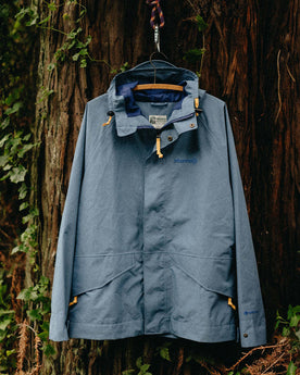 The Owens Parka in Moonlight Gore-Tex hanging in the woods, Outerwear by Taylor Stitch