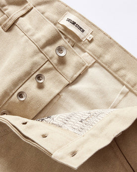 material shot of the button fly on The Camp Pant in Light Khaki Chipped Canvas, Bottoms by Taylor Stitch