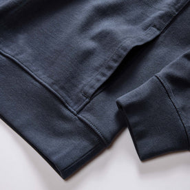 material shot of the pocket on The Rugby Quarter Zip in Faded Navy