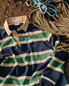 The Rugby Shirt in Navy Stripe next to climbing rope, Knits by Taylor Stitch