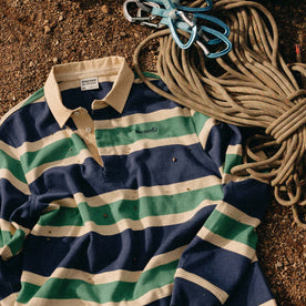 The Rugby Shirt in Navy Stripe next to climbing rope