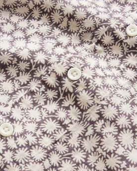 material shot of the buttons on The Short Sleeve Hawthorne in Fig Floral, Wovens by Taylor Stitch