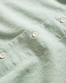 material shot of the buttons on The Short Sleeve Hawthorne in Sea Moss Floral, Wovens by Taylor Stitch