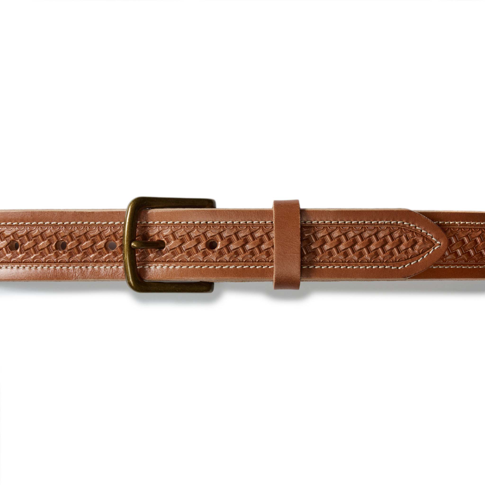 flatlay of the buckle on The Tooled Belt in Saddle Tan, Accessories by Taylor Stitch