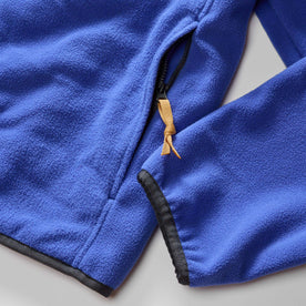 material shot of the zip pocket on The Trail Fleece in Alpine Dusk