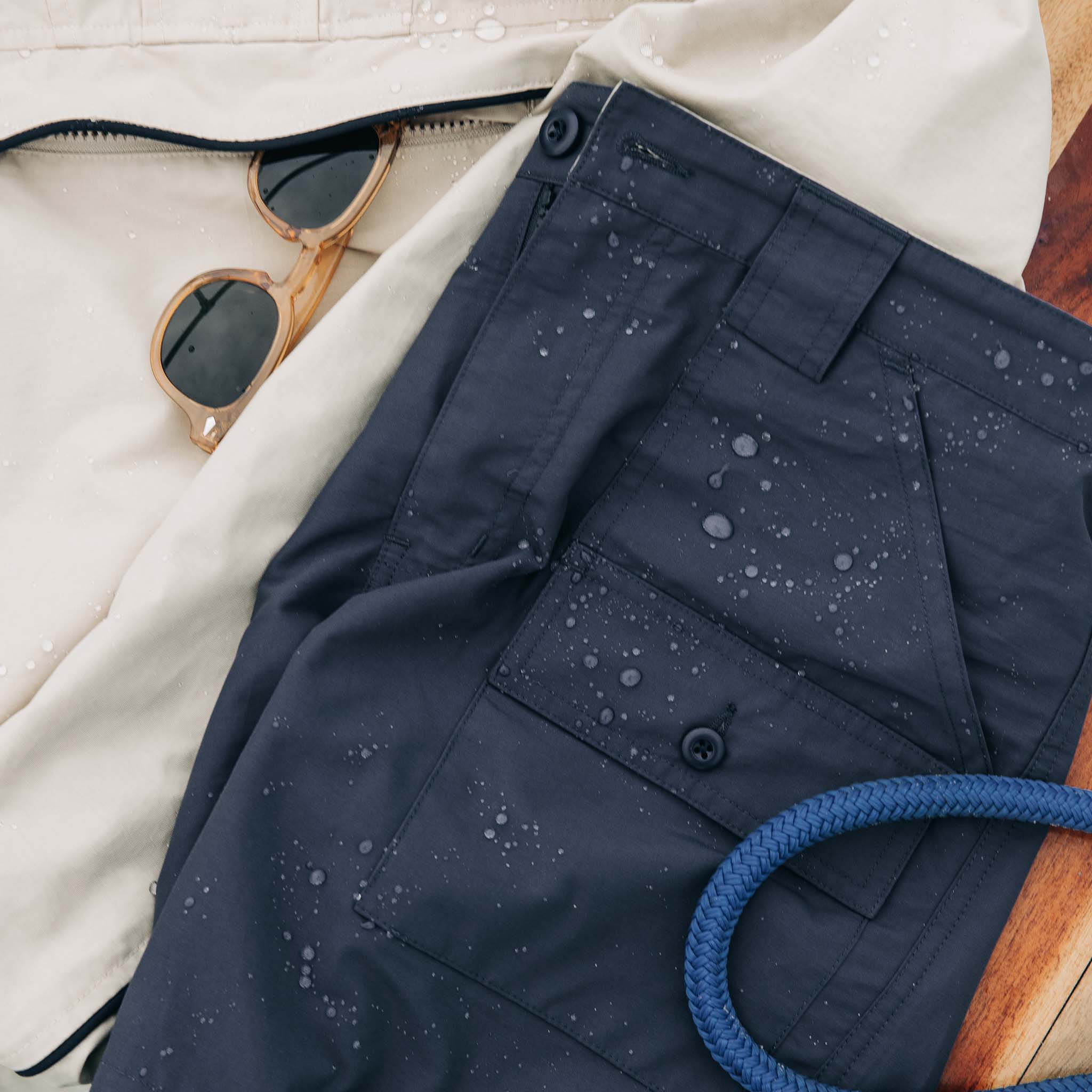 editorial image of The Trail Cargo Short in Faded Navy 60/40 Faille with water drops , Bottoms by Taylor Stitch