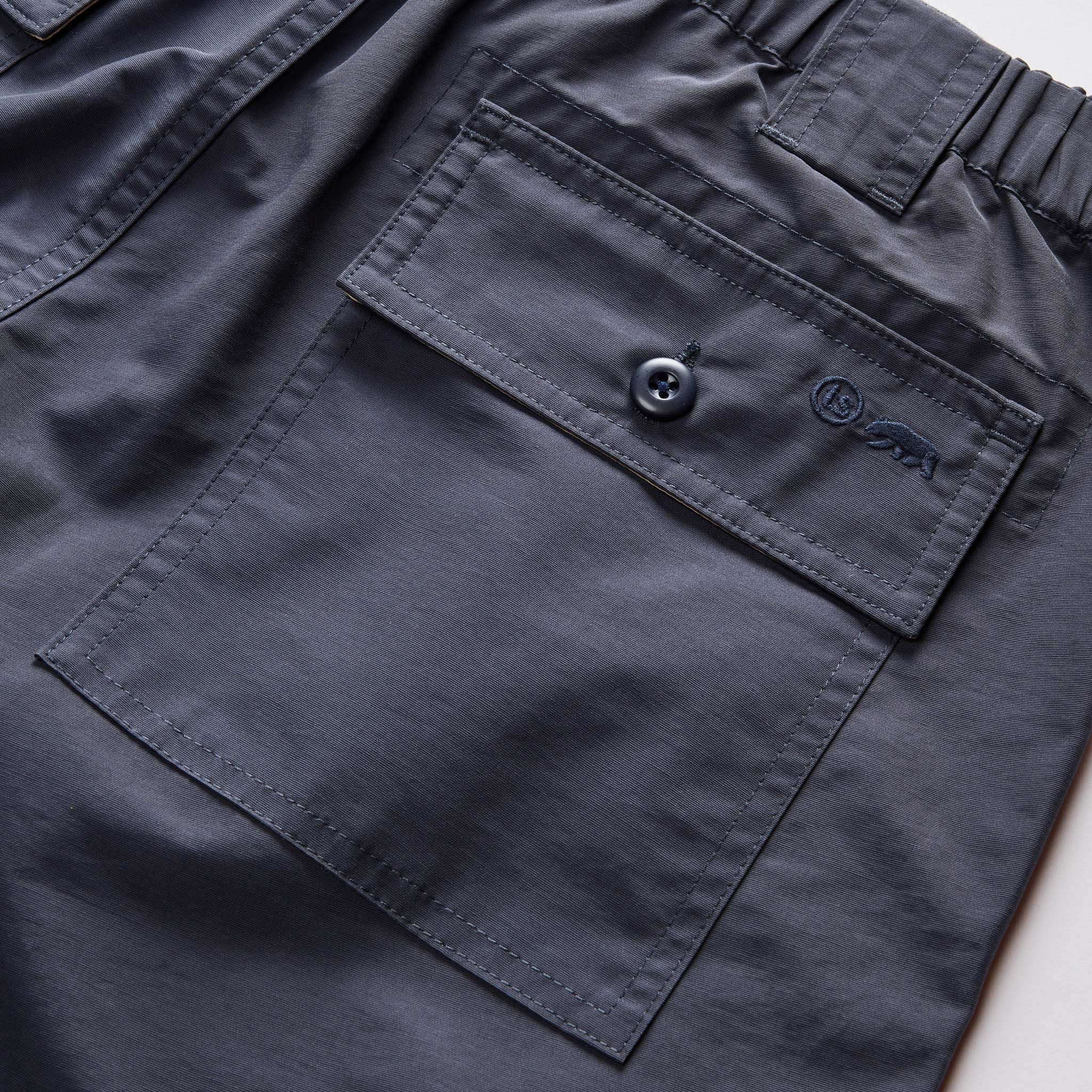 material shot of the back pockets on The Trail Cargo Short in Faded Navy 60/40 Faille, Bottoms by Taylor Stitch