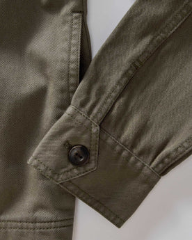 material shot of the cuffs on The Station Jacket in Fatigue Olive Broken Twill, Outerwear by Taylor Stitch