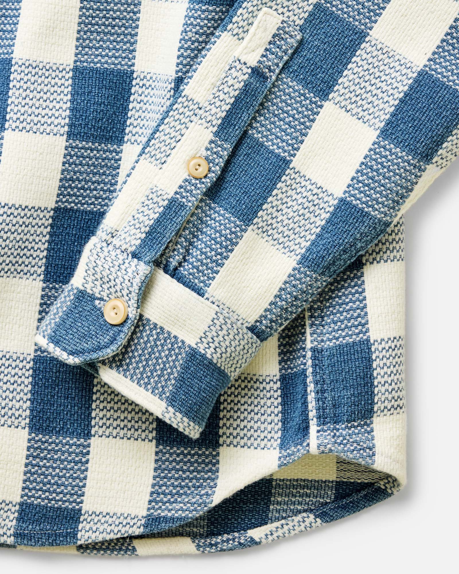 material shot of the buttons on The Division Shirt in Washed Indigo Check, Wovens by Taylor Stitch