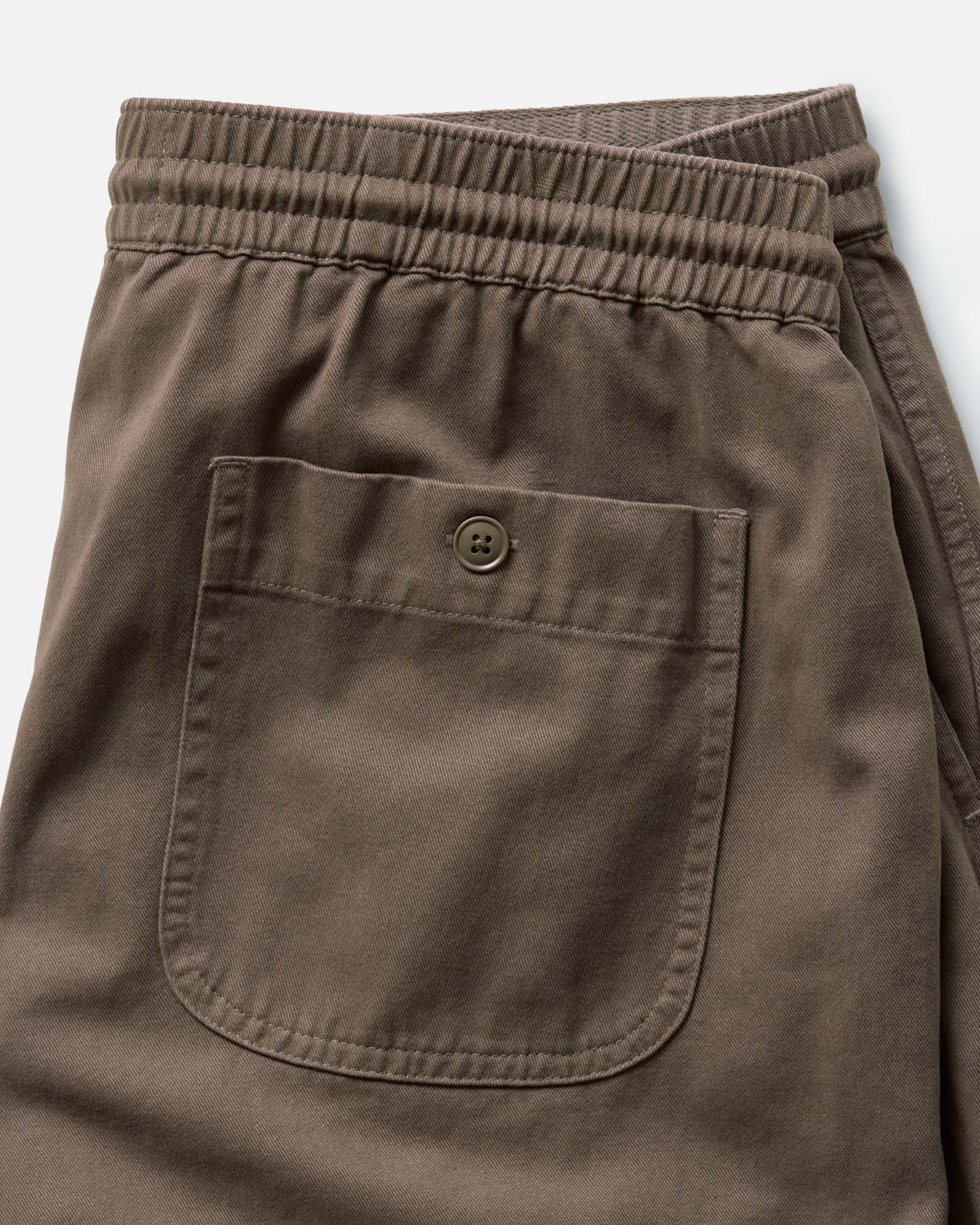 material shot of the back pocket on The Apres Short in Organic Espresso Foundation Twill, Bottoms by Taylor Stitch