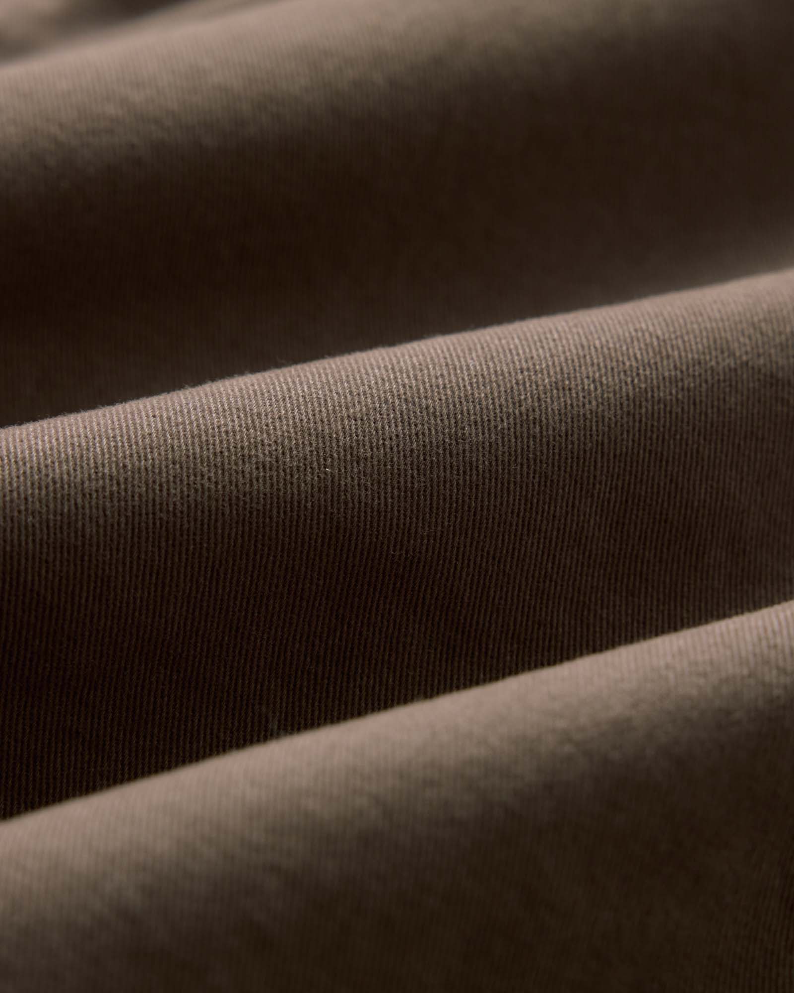material shot of the fabric on The Apres Short in Organic Espresso Foundation Twill, Bottoms by Taylor Stitch