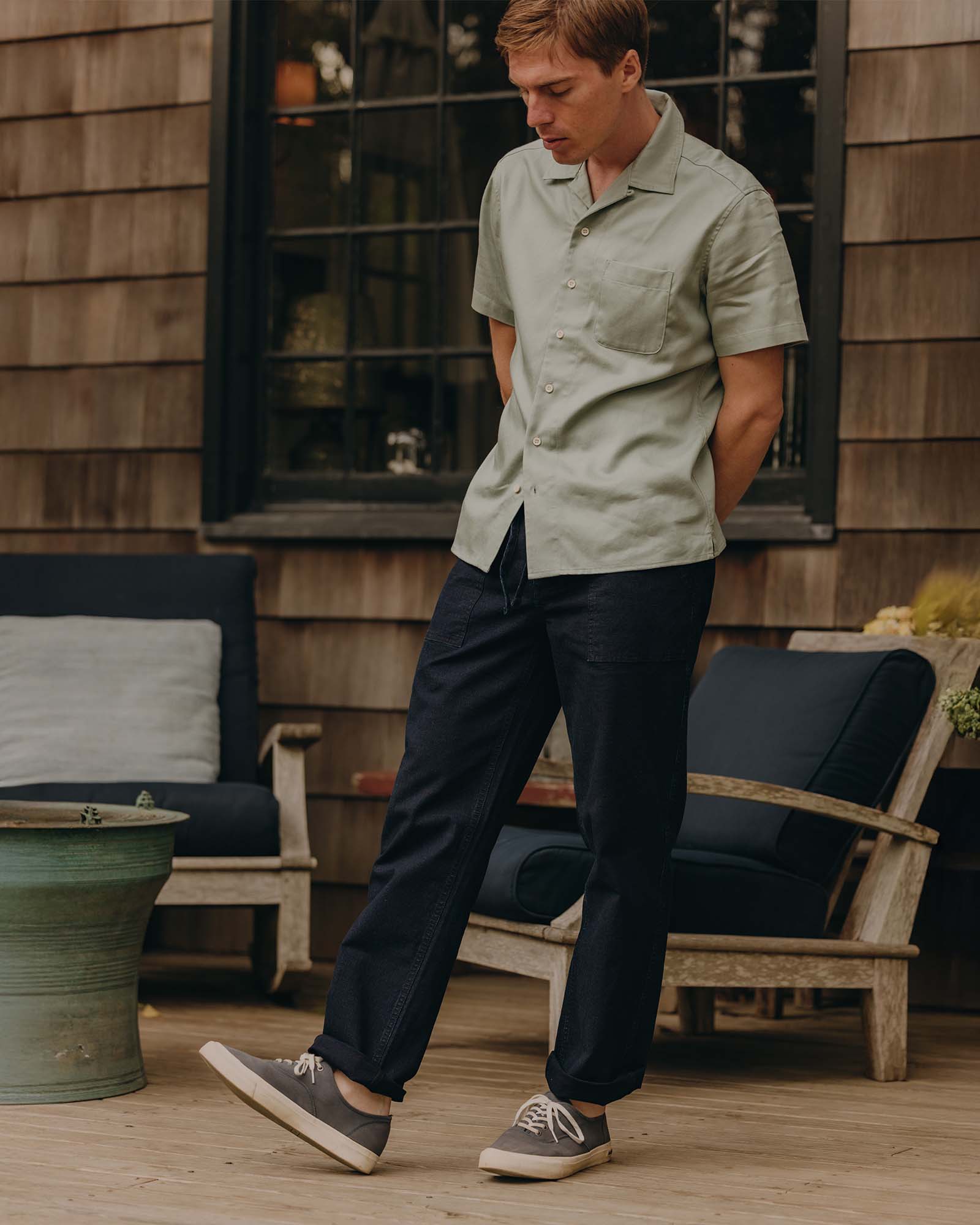 fit model walking wearing The Breakwater Pant in Rinsed Indigo Ripstop, Bottoms by Taylor Stitch