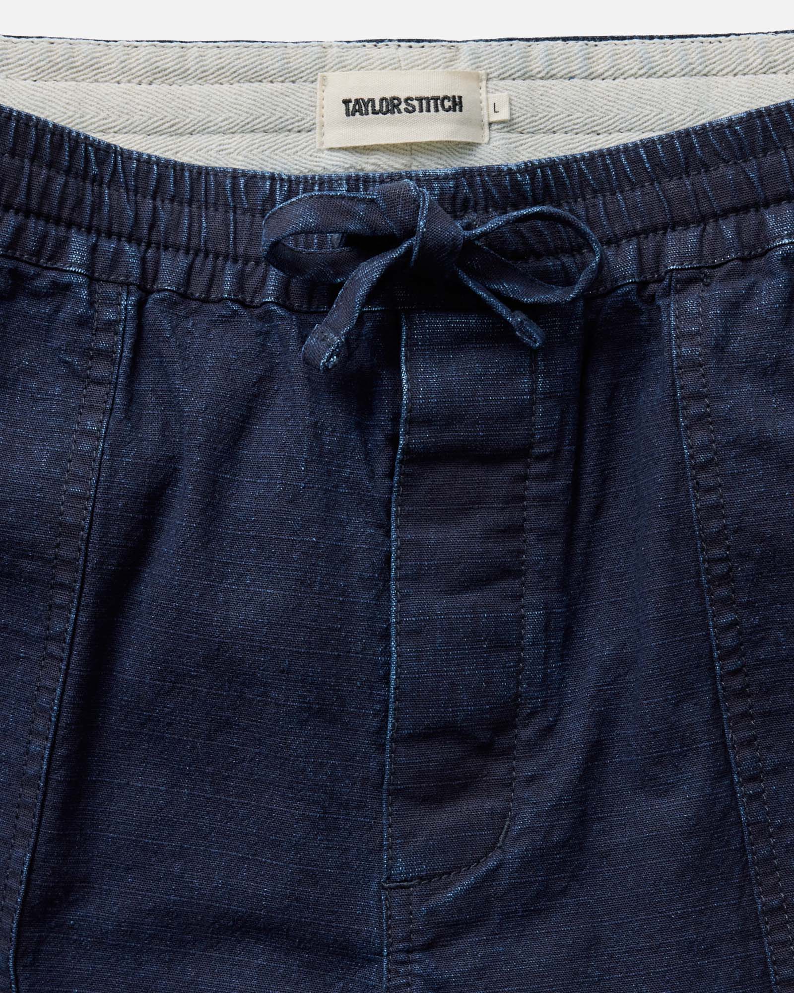 material shot of the waistband on The Breakwater Pant in Rinsed Indigo Ripstop, Bottoms by Taylor Stitch