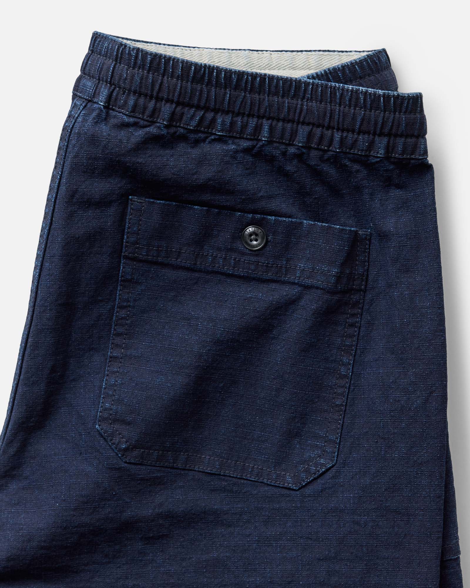 material shot of the pocket on The Breakwater Pant in Rinsed Indigo Ripstop, Bottoms by Taylor Stitch