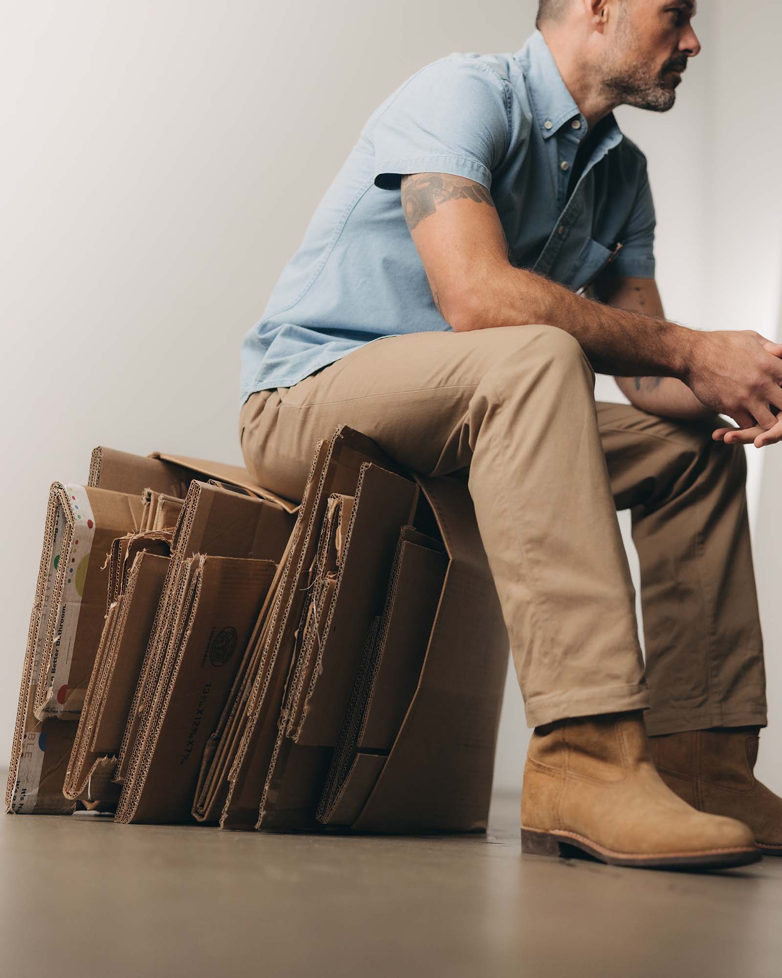 fit model with his hand in his pocket wearing The Democratic Foundation Pant in Organic Khaki, Bottoms by Taylor Stitch