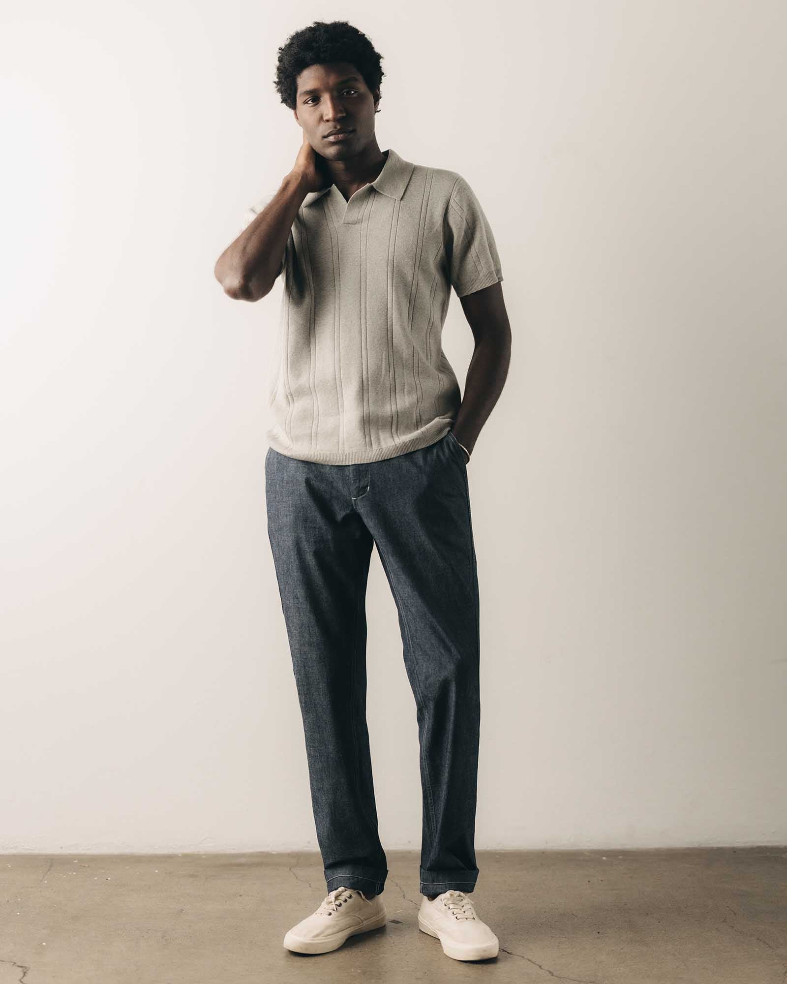 fit model standing wearing The Easy Pant in Washed Indigo Chambray, Bottoms by Taylor Stitch