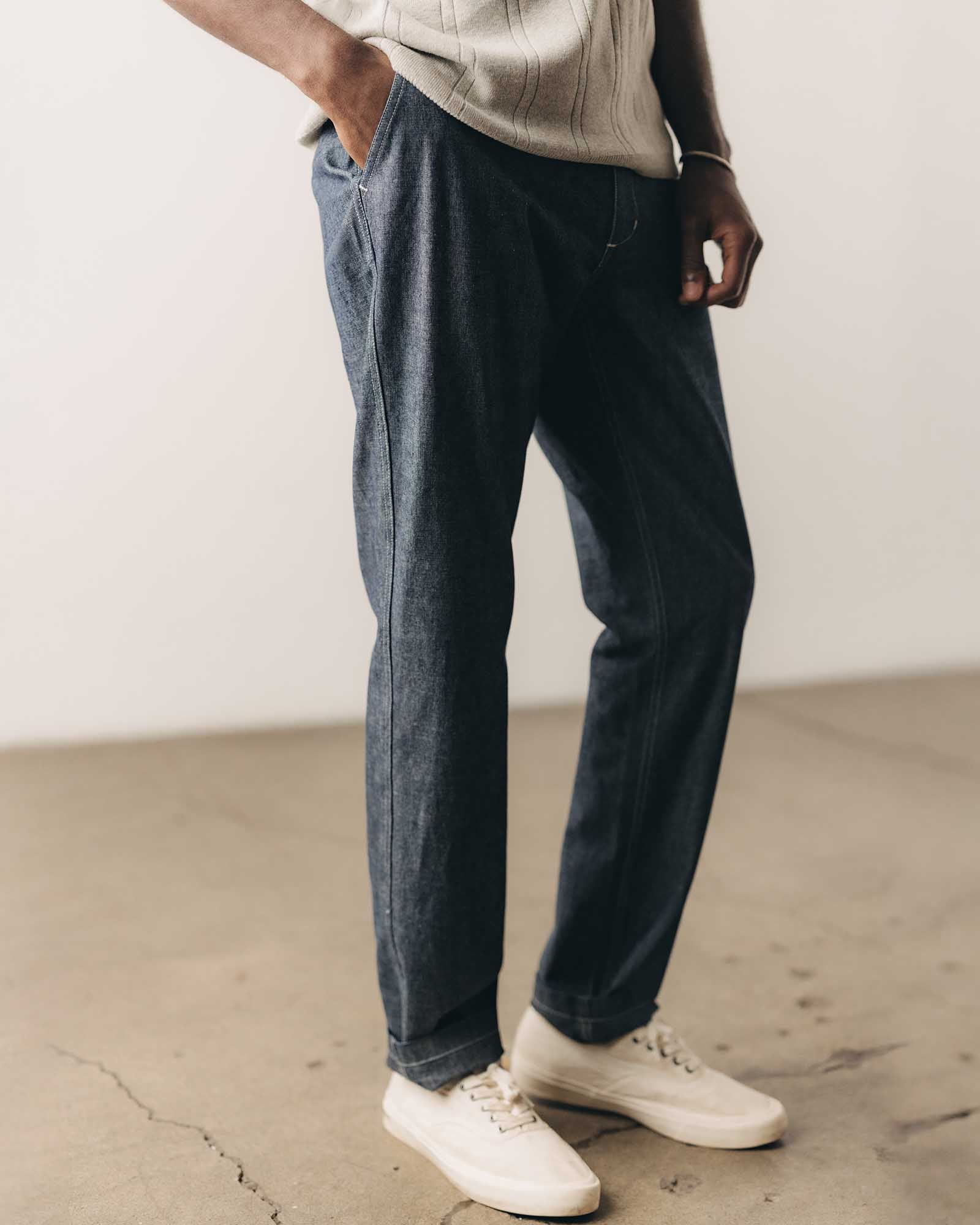 fit model posing in The Easy Pant in Washed Indigo Chambray, Bottoms by Taylor Stitch