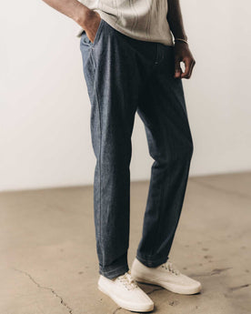 fit model posing in The Easy Pant in Washed Indigo Chambray, Bottoms by Taylor Stitch