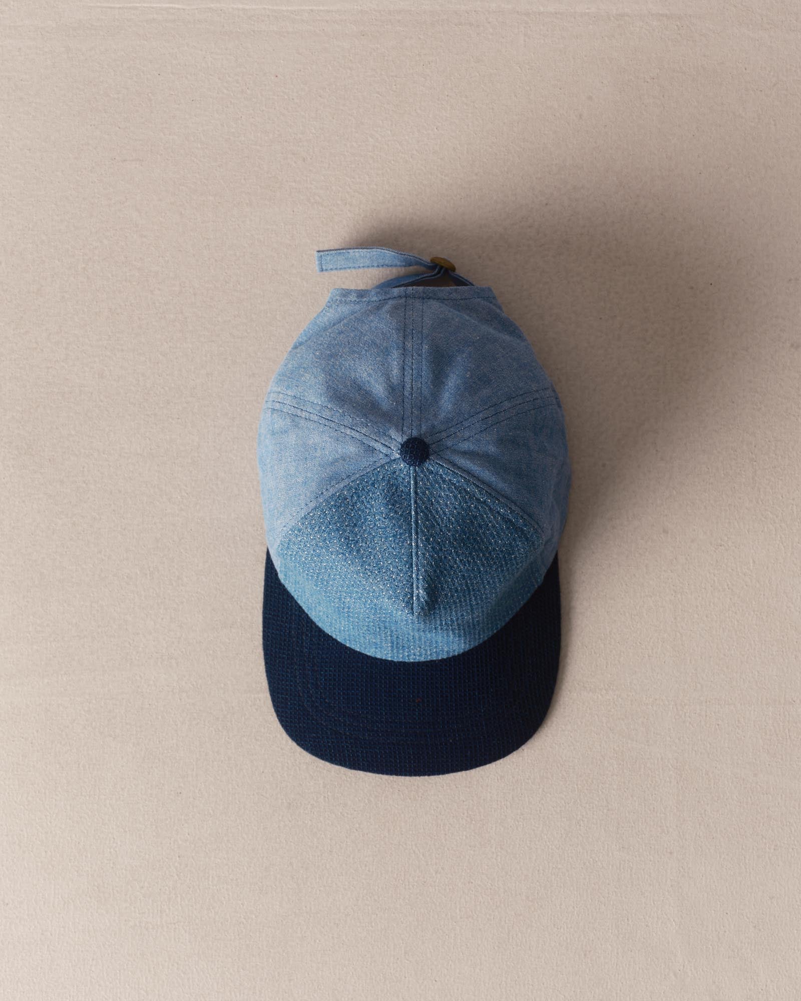 editorial image of The Taylor Stitch x Hypeadelic Cap v2.03 hanging