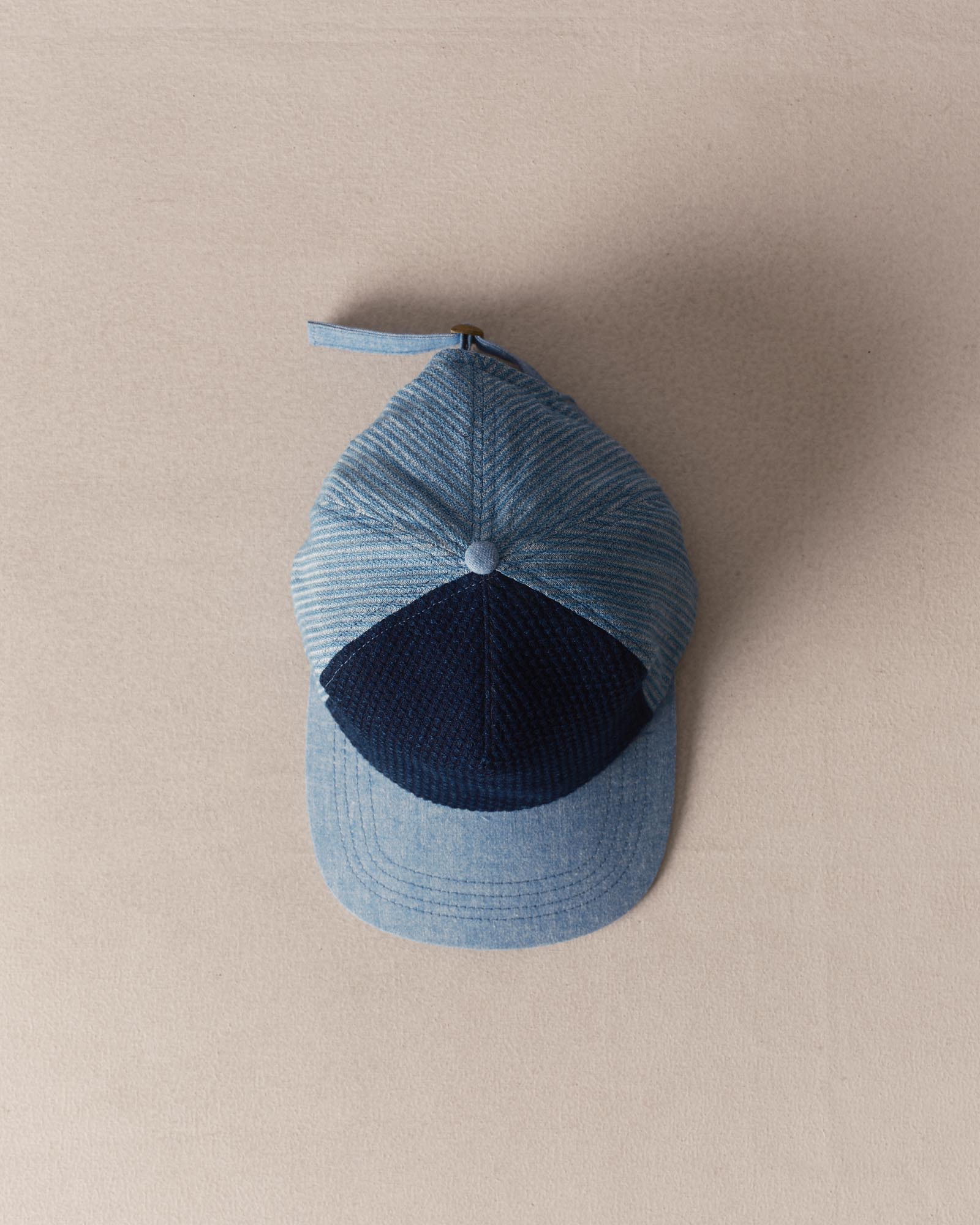 editorial image of The Taylor Stitch x Hypeadelic Cap v2.14 hanging