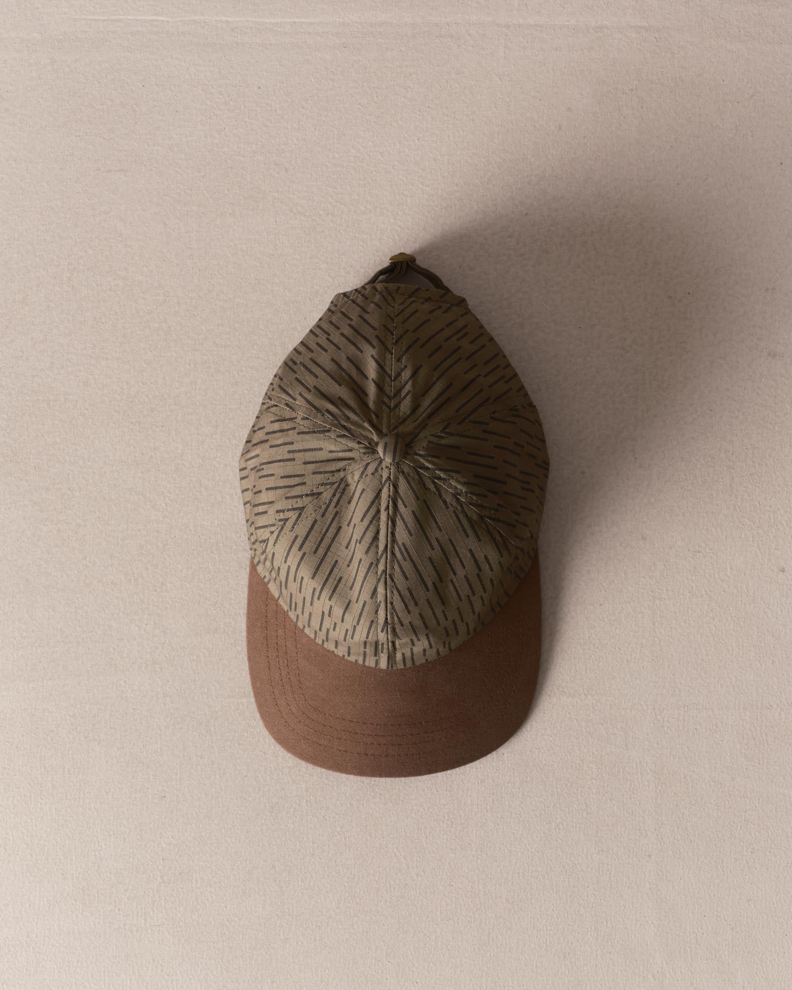 editorial image of The Taylor Stitch x Hypeadelic Cap v2.29 hanging