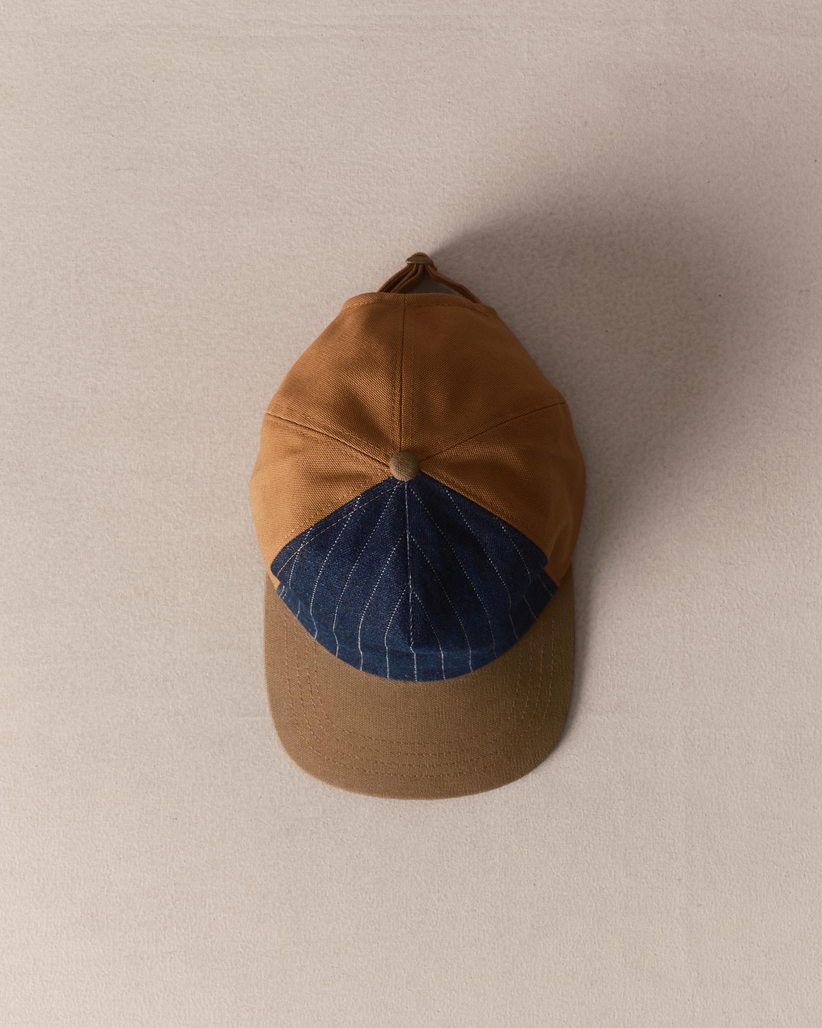 editorial image of The Taylor Stitch x Hypeadelic Cap v2.32 hanging