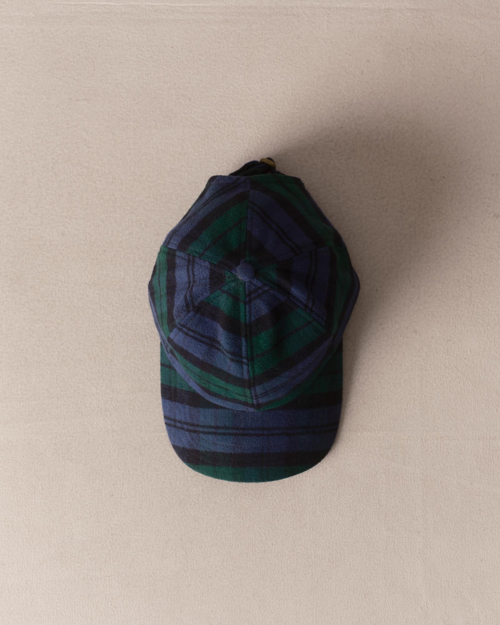 editorial image of The Taylor Stitch x Hypeadelic Cap v2.42 hanging