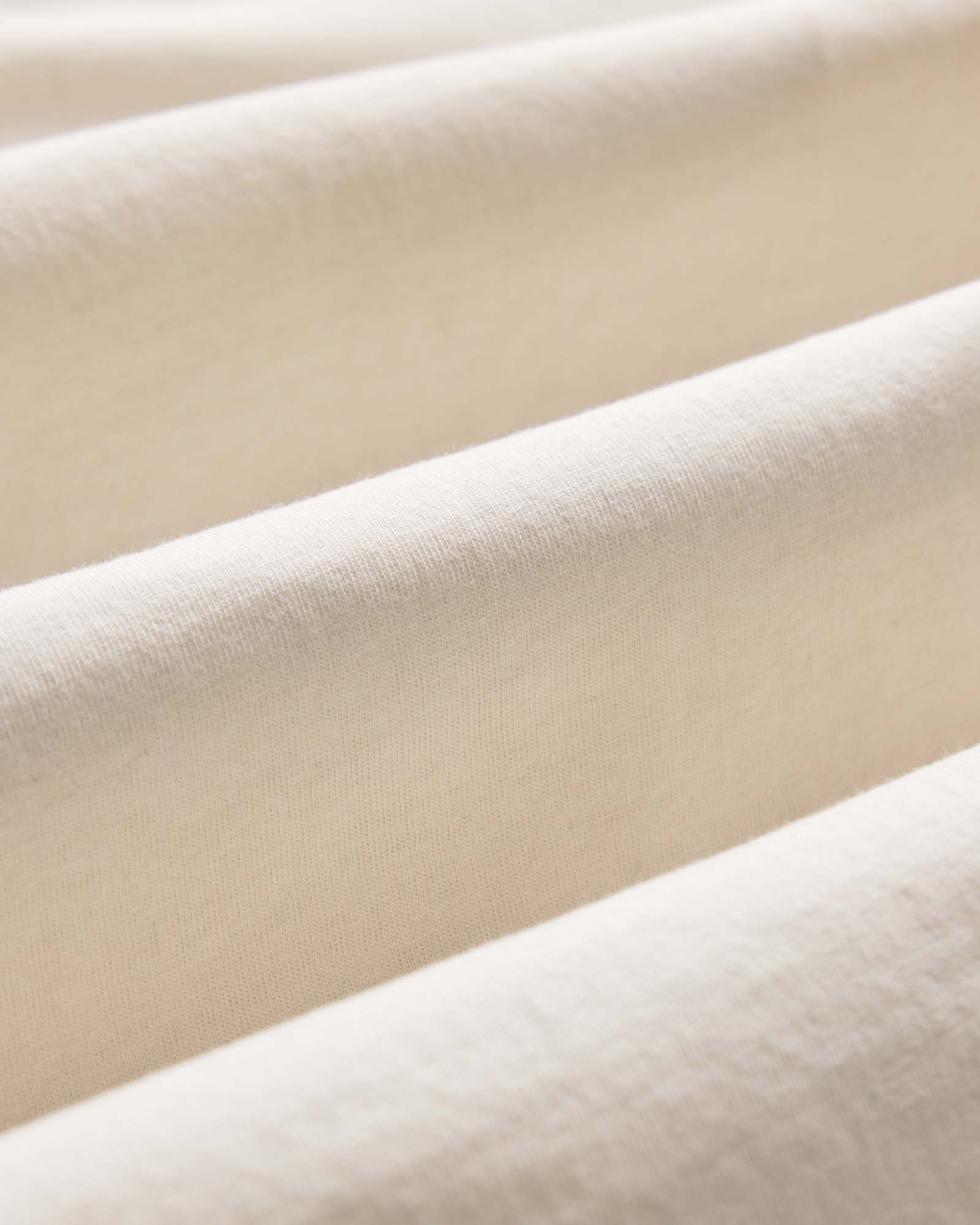 material shot of the fabric on The Organic Cotton Long Sleeve Tee in Vintage White, Knits by Taylor Stitch