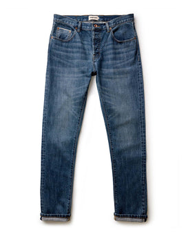 material shot of the button fly on The Slim Jean in Mid Wash Organic Selvedge, Bottoms by Taylor Stitch