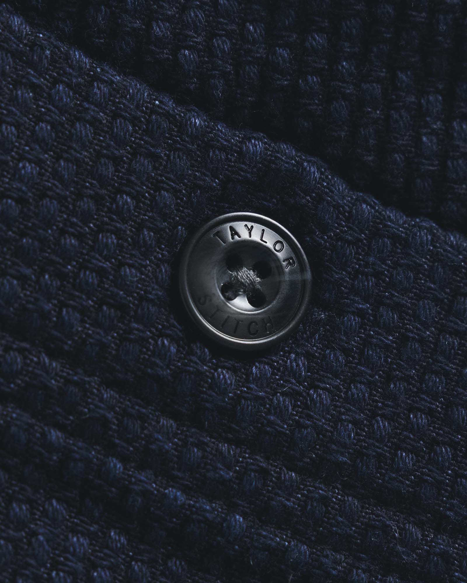 material shot of the button on The Breakwater Pant in Rinsed Indigo Sashiko, Bottoms by Taylor Stitch