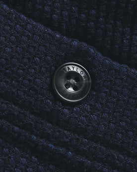 material shot of the button on The Breakwater Pant in Rinsed Indigo Sashiko, Bottoms by Taylor Stitch
