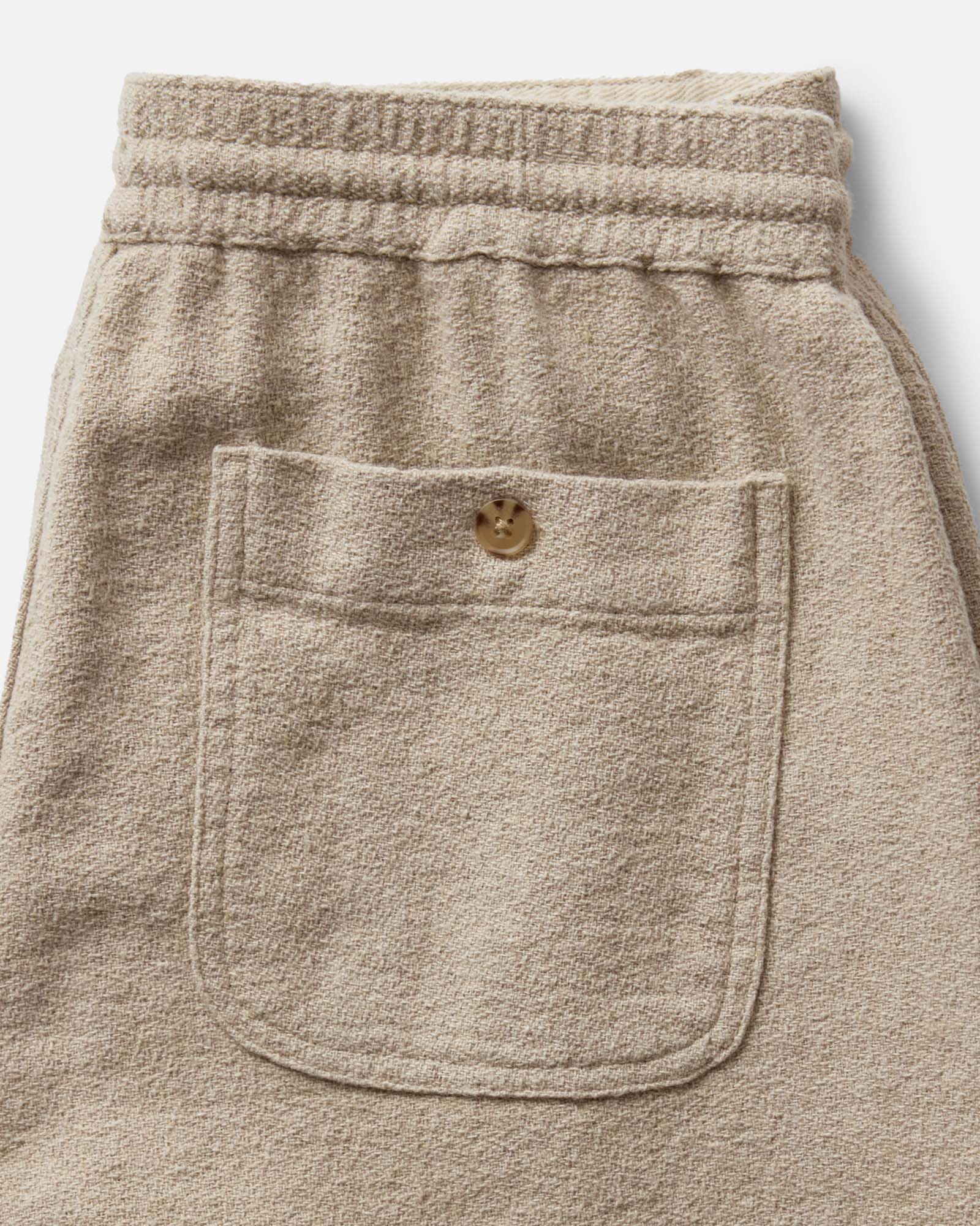 material shot of the back pocket on The Apres Short in Heather Oat Crepe, Bottoms by Taylor Stitch