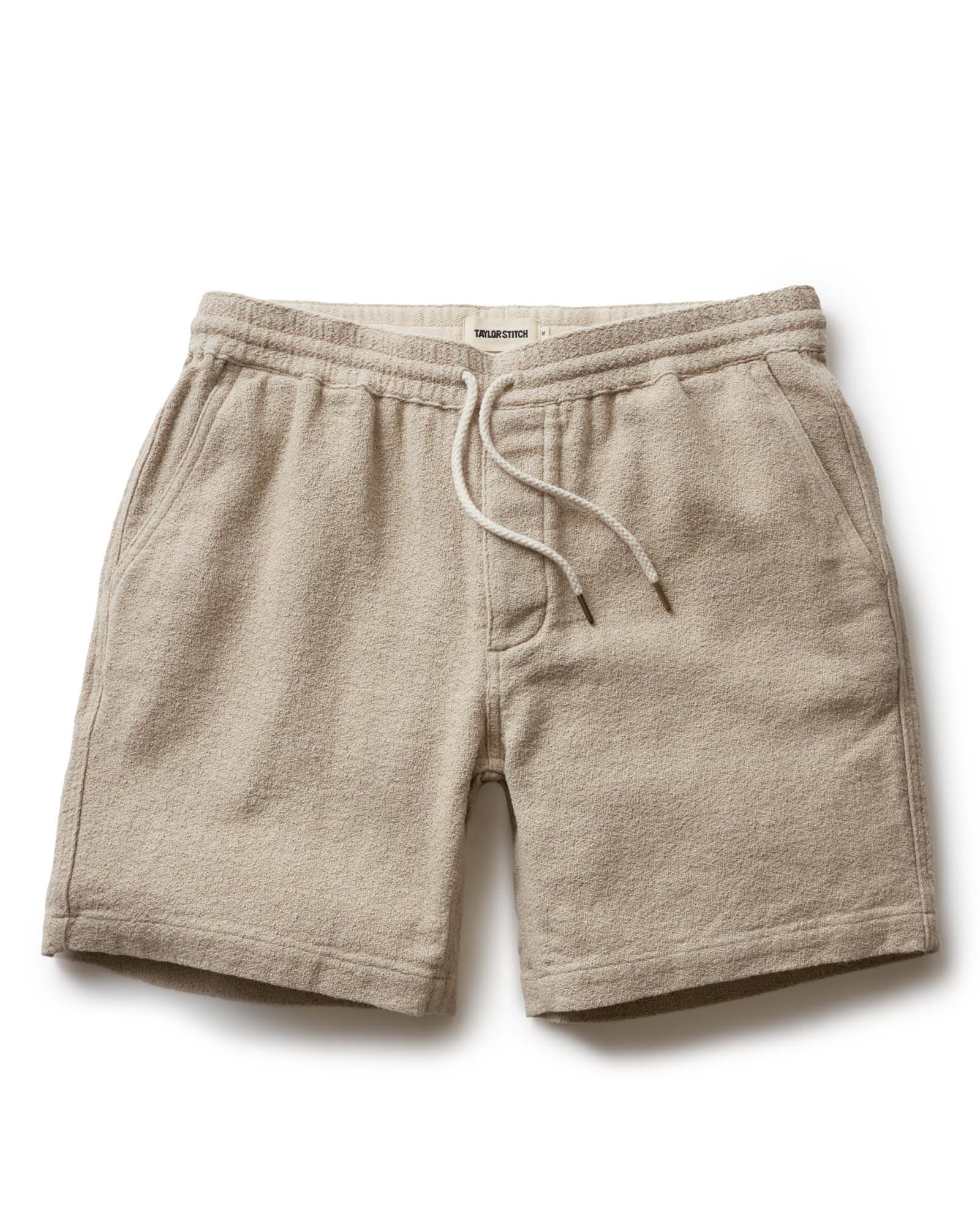 flatlay of The Apres Short in Heather Oat Crepe, Bottoms by Taylor Stitch