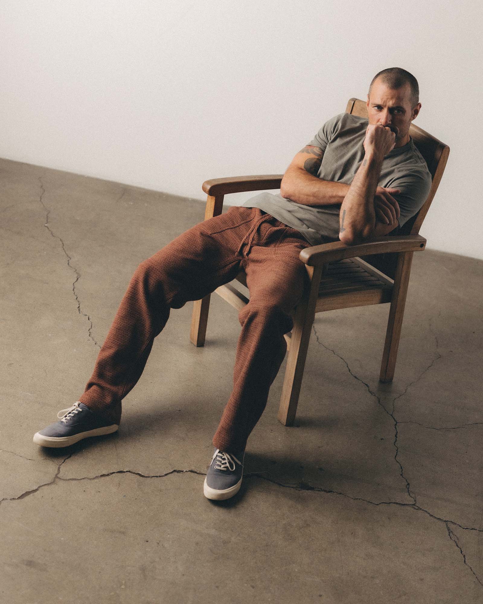 fit model sitting in The Breakwater Pant in Black Cherry Sashiko, Bottoms by Taylor Stitch