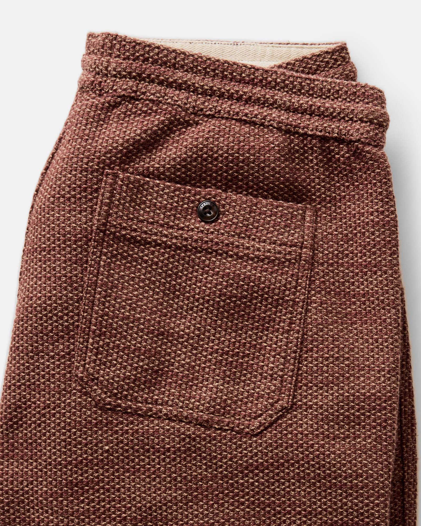 material shot of the back pocket on The Breakwater Pant in Black Cherry Sashiko, Bottoms by Taylor Stitch