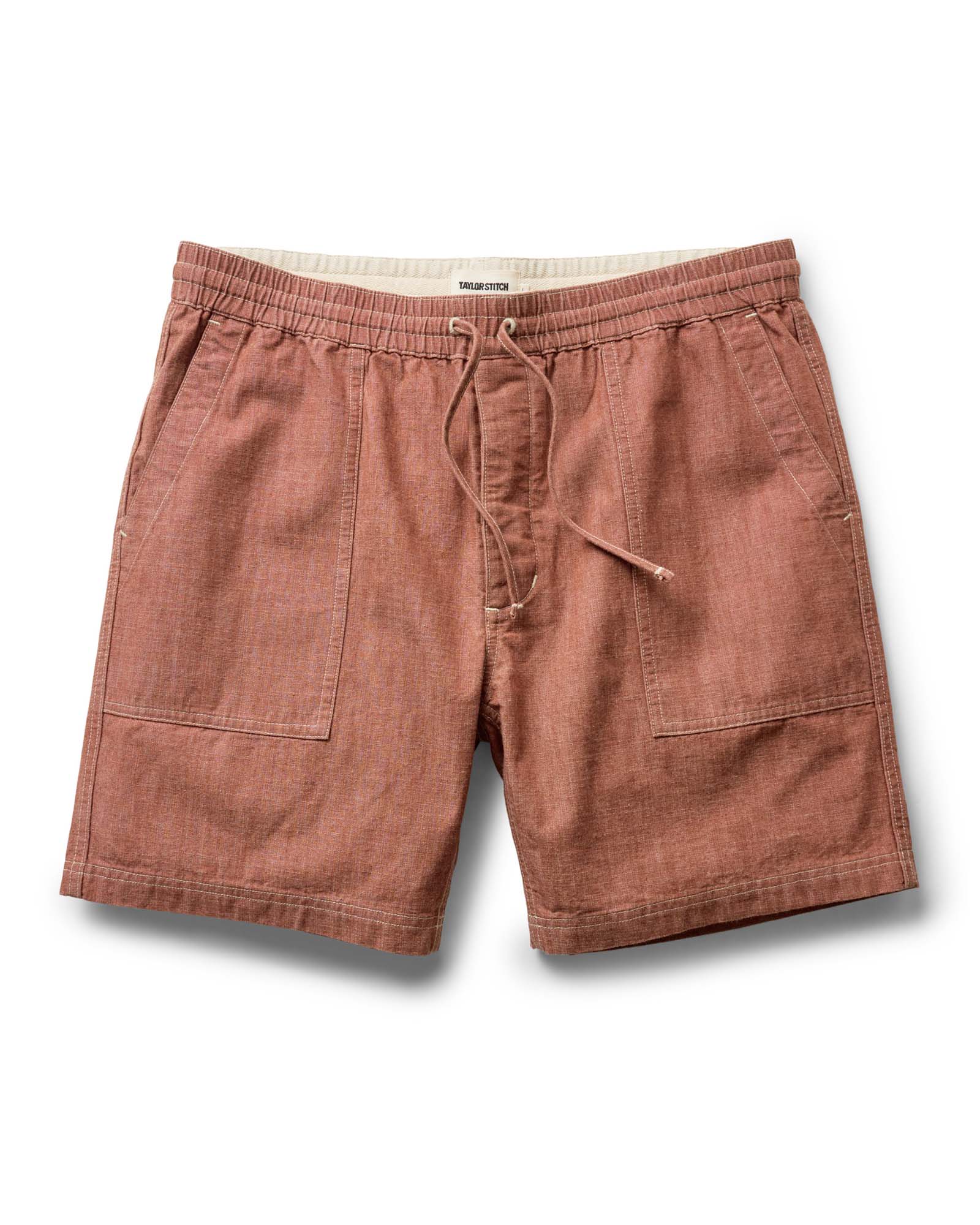 flatlay of The Breakwater Short in Brick Chambray, Bottoms by Taylor Stitch